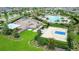 Aerial view of community featuring a pool, playground, and basketball court at 11911 Sunburst Marble Rd, Riverview, FL 33579