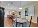 Open kitchen and dining area with stainless steel appliances, granite countertops, and ample counter space at 11911 Sunburst Marble Rd, Riverview, FL 33579