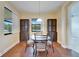 Cozy dining area with views of the trees and nature and built in cabinets for storage at 11911 Sunburst Marble Rd, Riverview, FL 33579