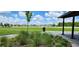 Community green space offers plenty of room for activities, views of neighborhood homes at 11911 Sunburst Marble Rd, Riverview, FL 33579