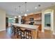 Island kitchen features modern appliances, granite countertops, and barstool seating at 11911 Sunburst Marble Rd, Riverview, FL 33579