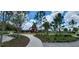 Community playground with slides and play structures, surrounded by lush greenery and walking paths at 11911 Sunburst Marble Rd, Riverview, FL 33579