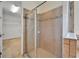 Spacious walk-in shower featuring a glass enclosure and neutral toned tile surround at 11911 Sunburst Marble Rd, Riverview, FL 33579