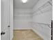 Walk-in closet with wire shelving and neutral colored carpeting at 11911 Sunburst Marble Rd, Riverview, FL 33579