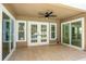 Covered patio with a ceiling fan and direct access to the pool at 12106 Clearbrook Ct, Riverview, FL 33569