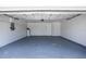A clean and organized two-car garage with ample space for vehicles and storage at 12106 Clearbrook Ct, Riverview, FL 33569