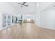 Open-concept living room with high ceilings, great light, and a view to the kitchen and dining room at 12106 Clearbrook Ct, Riverview, FL 33569