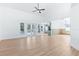 Spacious living room featuring high ceilings, an open concept, and a view to the kitchen and backyard at 12106 Clearbrook Ct, Riverview, FL 33569