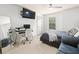 Bedroom featuring a modern design, a bed and tv, and a dedicated workspace at 12912 Arbor Isle Dr # 202, Temple Terrace, FL 33637