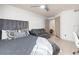 Bedroom with a gray bed, couch, decorative pillows, and a gray headboard at 12912 Arbor Isle Dr # 202, Temple Terrace, FL 33637