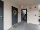 Condo front door with decorative wreath, unit number, and 'Home' welcome mat at 12912 Arbor Isle Dr # 202, Temple Terrace, FL 33637