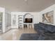 Cozy living room with tile flooring, built-in shelving, and a comfortable sectional sofa at 12912 Arbor Isle Dr # 202, Temple Terrace, FL 33637