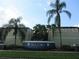 Exterior view of building entrance with mature palm trees at 1301 S Howard Ave # C4, Tampa, FL 33606