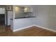 Kitchen area with white cabinets, stainless steel appliances, and breakfast bar at 1301 S Howard Ave # C4, Tampa, FL 33606