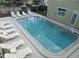 Community pool with lounge chairs and well-maintained surrounding area at 1301 S Howard Ave # C4, Tampa, FL 33606