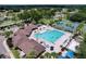 Resort-style pool surrounded by lounging areas and lush landscaping create a vacation-like atmosphere at 1319 Dew Bloom Rd, Valrico, FL 33594
