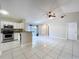 Modern kitchen seamlessly connected to the living area, equipped with stainless steel appliances and ample counter space at 1319 Dew Bloom Rd, Valrico, FL 33594