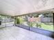 Enclosed patio area, ideal for outdoor entertaining and relaxation, with backyard views at 1319 Dew Bloom Rd, Valrico, FL 33594