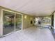 Tiled patio provides a seamless transition to outdoor living and screened-in enclosure at 1319 Dew Bloom Rd, Valrico, FL 33594