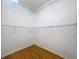 Empty walk-in closet with rod and shelf storage in a home interior at 1319 Dew Bloom Rd, Valrico, FL 33594