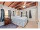 Bedroom with a wooden ceiling, tile flooring, natural light, and a large bed at 1533 Suffolk N St, St Petersburg, FL 33710
