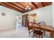 Cozy dining room with wood table and chairs, vintage china cabinet, and tile floors at 1533 Suffolk N St, St Petersburg, FL 33710