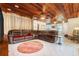 Open living room features tile floors, ceiling fan, and plush seating area at 1533 Suffolk N St, St Petersburg, FL 33710