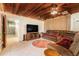Comfortable living room featuring tile flooring, wood ceiling and a television at 1533 Suffolk N St, St Petersburg, FL 33710