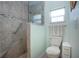 Modern bathroom with glass-enclosed shower and accessible features at 2019 Gardenia Landings Lane Ln, Sun City Center, FL 33573