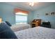 Bedroom with a desk, two twin beds, and a view of the outdoors at 2019 Gardenia Landings Lane Ln, Sun City Center, FL 33573