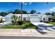 Charming single-story home featuring a two-car garage, lush landscaping, and a well-manicured lawn at 2019 Gardenia Landings Lane Ln, Sun City Center, FL 33573