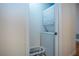 Efficient laundry area features a stackable washer and dryer with space for laundry supplies at 2019 Gardenia Landings Lane Ln, Sun City Center, FL 33573