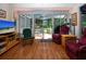Comfortable living area with access to the screened lanai at 2019 Gardenia Landings Lane Ln, Sun City Center, FL 33573