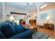 Bright living room with high ceilings, hardwood floors, and sliding glass doors to the lanai at 2019 Gardenia Landings Lane Ln, Sun City Center, FL 33573