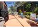 Spacious screened patio with seating offers a seamless transition to the outdoors at 2019 Gardenia Landings Lane Ln, Sun City Center, FL 33573