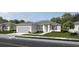 Charming one-story home with a two-car garage, landscaped yard, and welcoming entryway at 2204 S Biscayne Dr, North Port, FL 34287