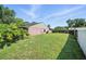 Expansive backyard with a well-kept lawn and a sturdy privacy fence providing a safe place to play at 22422 Stillwood Dr, Land O Lakes, FL 34639