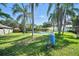 Beautiful backyard with a pool, lush tropical landscaping, and well-maintained lawn at 22422 Stillwood Dr, Land O Lakes, FL 34639