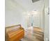 Welcoming entryway featuring wood-look flooring, a charming wood bench, and natural light at 22422 Stillwood Dr, Land O Lakes, FL 34639