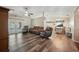 Open-concept living room with wood floors, high ceilings, and access to the outdoor area at 22422 Stillwood Dr, Land O Lakes, FL 34639
