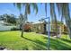 Two wooden sheds with a fenced in area in the backyard of the property at 22422 Stillwood Dr, Land O Lakes, FL 34639