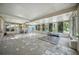 Spacious sun room with multiple windows, ample natural light, and potential for customization at 22422 Stillwood Dr, Land O Lakes, FL 34639