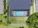 Aerial view showcases the screened pool and well-maintained backyard of this home at 2812 Windcrest Oaks Ct, Valrico, FL 33594