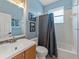 Cozy bathroom with sky blue walls, standard fixtures, and a shower-tub combo, perfect for everyday convenience at 2812 Windcrest Oaks Ct, Valrico, FL 33594