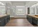 Elegant bathroom featuring dual vanities, a soaking tub, and a glass-enclosed shower providing spa-like luxury at 2812 Windcrest Oaks Ct, Valrico, FL 33594