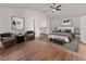 Spacious bedroom featuring vaulted ceilings, ceiling fan, and minimalist décor providing a luxurious and airy feel at 2812 Windcrest Oaks Ct, Valrico, FL 33594