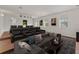 Spacious home theater with seating, screen, and lounge area at 2812 Windcrest Oaks Ct, Valrico, FL 33594