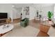 Open-concept living and dining area featuring hardwood floors, modern furnishings, and easy access to other rooms at 2812 Windcrest Oaks Ct, Valrico, FL 33594