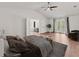 Spacious main bedroom suite with vaulted ceiling, balcony access, and a connecting ensuite bathroom at 2812 Windcrest Oaks Ct, Valrico, FL 33594