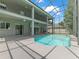Enjoy the screened pool and patio of this two story home, ideal for outdoor fun at 2812 Windcrest Oaks Ct, Valrico, FL 33594